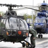 Freigelände: Bundeswehr Panzerabwehr- und Verbindungshubschrauber Bo105 und Super Puma Zweiturbinen Helicopter der Bundespolizei im Hintergrund.