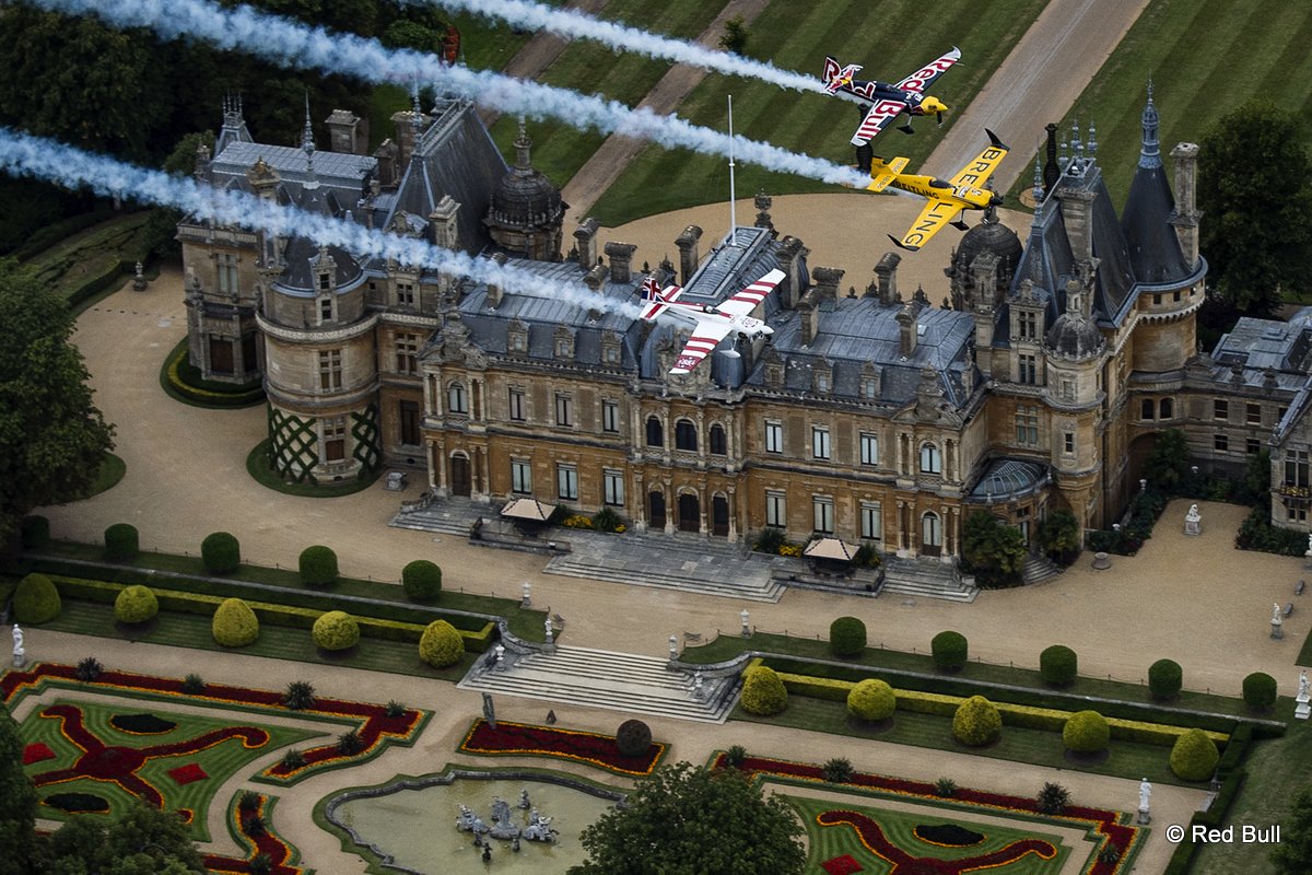 Nigel Lamb and Paul Bohomme of Great Britain give Peter Besenyei of Hungary an aerial view of their home country ahead of the weekend\'s Red Bull Air Race World Championship stop in Ascot over the Waddesdon Manor in the heart of the Buckinghamshire countryside near Oxford in the United Kingdom on August 11, 2015.