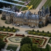 Nigel Lamb and Paul Bohomme of Great Britain give Peter Besenyei of Hungary an aerial view of their home country ahead of the weekend\'s Red Bull Air Race World Championship stop in Ascot over the Waddesdon Manor in the heart of the Buckinghamshire countryside near Oxford in the United Kingdom on August 11, 2015.