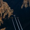 Paul Bonhomme of Great Britain, Peter Besenyei of Hungary and Matt Hall of Australia fly over the Grand Canyon prior to the eight and final stage of the Red Bull Air Race World Championship in Arizona, United States on October 14, 2015.
