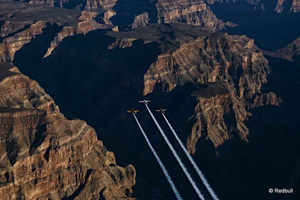 Paul Bonhomme of Great Britain, Peter Besenyei of Hungary and Matt Hall of Australia fly over the Grand Canyon prior to the eight and final stage of the Red Bull Air Race World Championship in Arizona, United States on October 14, 2015.