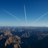 Paul Bonhomme of Great Britain, Peter Besenyei of Hungary and Matt Hall of Australia fly over the Grand Canyon prior to the eight and final stage of the Red Bull Air Race World Championship in Arizona, United States on October 14, 2015.
