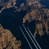 Paul Bonhomme of Great Britain, Peter Besenyei of Hungary and Matt Hall of Australia fly over the Grand Canyon prior to the eight and final stage of the Red Bull Air Race World Championship in Arizona, United States on October 14, 2015.