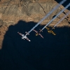 Paul Bonhomme of Great Britain, Peter Besenyei of Hungary and Matt Hall of Australia fly over the Grand Canyon prior to the eight and final stage of the Red Bull Air Race World Championship in Arizona, United States on October 14, 2015.