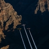 Paul Bonhomme of Great Britain, Peter Besenyei of Hungary and Matt Hall of Australia fly over the Grand Canyon prior to the eight and final stage of the Red Bull Air Race World Championship in Arizona, United States on October 14, 2015.