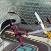 Kirby Chambliss and Michael Goulian and Nigel Lamb Yoshihide Muroya  fly in formation over the Yas Marina Circuit prior to the first stop of the Red Bull Air Race World Championship in Abu Dhabi, United Arab Emirates on February 26, 2014.