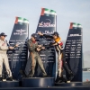 Daniel Ryfa of Sweden (L), Francois Le Vot of France (C) and Juan Velarde of Spain (R) celebrate during the Challengers Cup award ceremony for the first stage of the Red Bull Air Race World Championship in Abu Dhabi, United Arab Emirates on February 28, 2014.