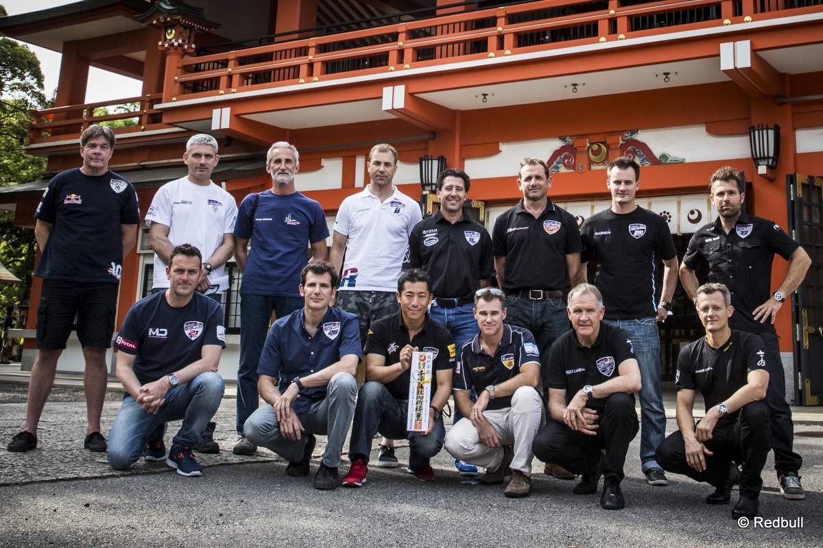 The pilots pose for a photograph in front of Chiba Shrine prior to the second stage of the Red Bull Air Race World Championship in Chiba, Japan on May 14, 2015.