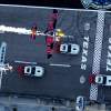 Kirby Chambliss of the United States flies in formation with Hannes Arch of Austria prior to the sixt stage of the Red Bull Air Race World Championship over the Texas Motor Speedway in Fort Worth, United States on September 04, 2014.