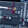 Kirby Chambliss of the United States flies in formation with Hannes Arch of Austria prior to the sixt stage of the Red Bull Air Race World Championship over the Texas Motor Speedway in Fort Worth, United States on September 04, 2014.