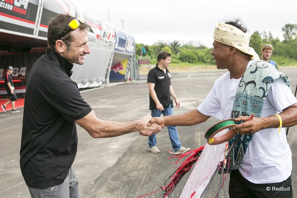 Nicolas Ivanoff of France learning how to fly a traditional Malaysian kite called the Wau at the race airport during the Red Bull Air Race Putrajaya 2014 in Putrajaya, Malaysia on May 14th 2014.