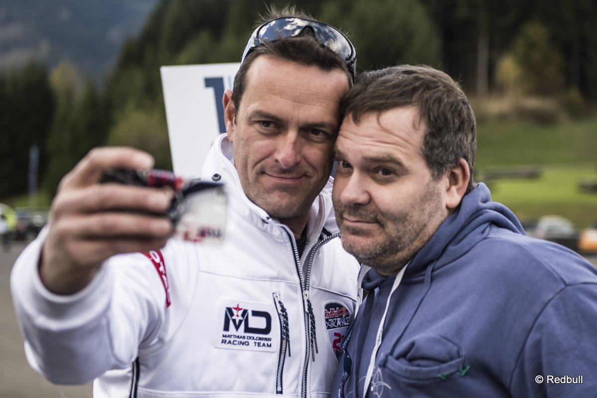 TV Moderator Alexander Duszat alias Elton of Germany poses for a photograph with Matthias Dolderer during the training for the eighth stage of the Red Bull Air Race World Championship at the Red Bull Ring in Spielberg, Austria on October 24, 2014.