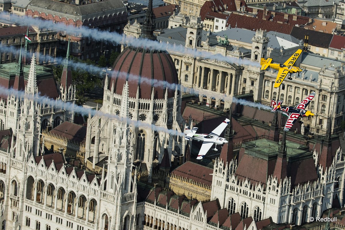 Peter Besenyei of Hungary leads Francois Le Vot of France and Martin Sonka of the Czech Republic during the Recon flight over the Parliament Building prior to the Red Bull Air Race World Championship in Budapest, Hungary on July 02, 2015.
