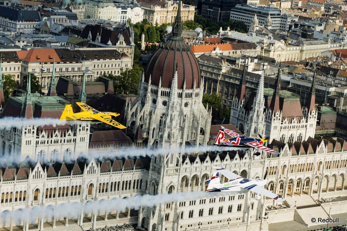 Peter Besenyei of Hungary leads Francois Le Vot of France and Martin Sonka of the Czech Republic during the Recon flight over the Parliament Building prior to the Red Bull Air Race World Championship in Budapest, Hungary on July 02, 2015.