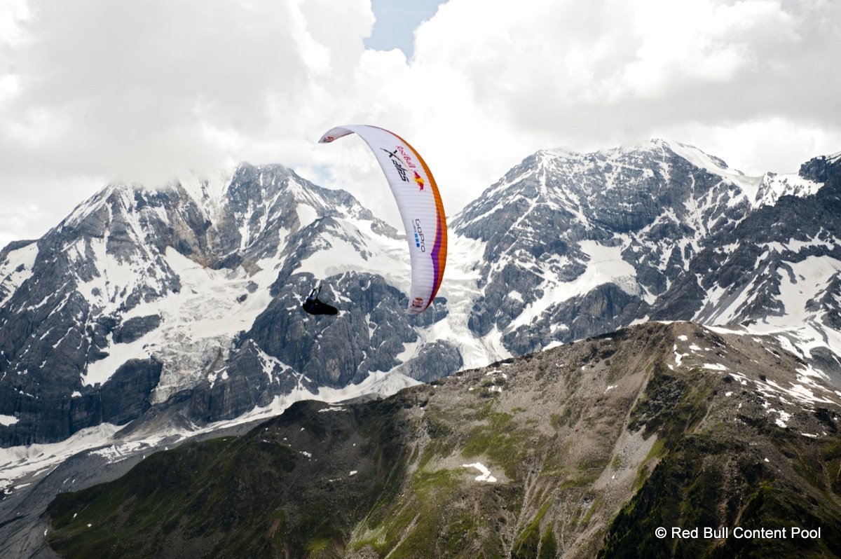 Competitor flies at the Red Bull X-Alps 2013 at Ortler in Sulden, Italy on July 10th, 2013