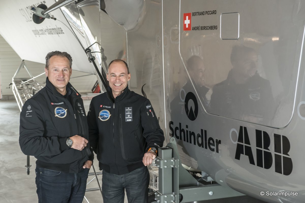 Payerne, Switzerland: (From left to right) André Borschberg, Co-founder and CEO and Bertrand Piccard, Initiator and Chairman are standing beside the cockpit of Solar Impulse 2, the single seater solar airplane with which they will attempt in 2015 the first round-the-world solar flight.