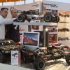 Fachbesucher interessieren sich fuer die neuesten Modelle bei HPI Racing. / Trade fair visitors are very interested in the latest models by HRI Racing.