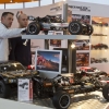 Fachbesucher interessieren sich fuer die neuesten Modelle bei HPI Racing. / Trade fair visitors are very interested in the latest models by HRI Racing.
