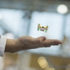 Ein Mitarbeiter der Firma Jamara Germany e.K. haelt seine Hand unter einen der kleinsten Quadrocopter Poky (An employee of the company Jamara Germany e.K. holds his hand under one of the smallest Quadrocopters, Poky)